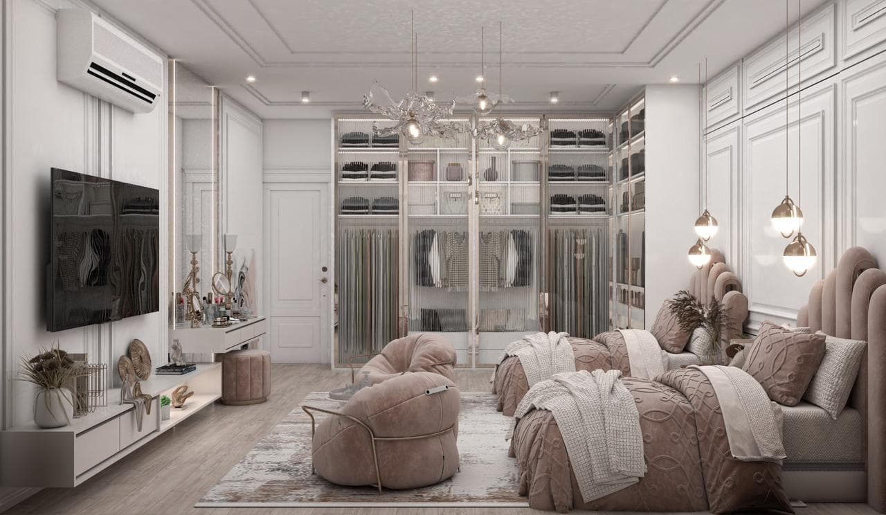 Master bedroom opening onto a glazed walk-in dressing room, with blush upholstery, integrated joinery and a chandelier