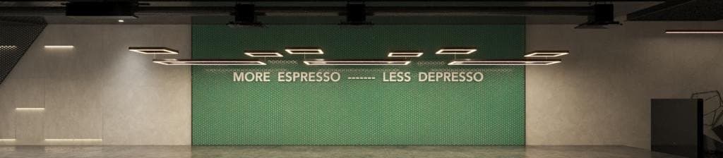 Interior wall lettering reading MORE ESPRESSO - LESS DEPRESSO, set above a cafe counter