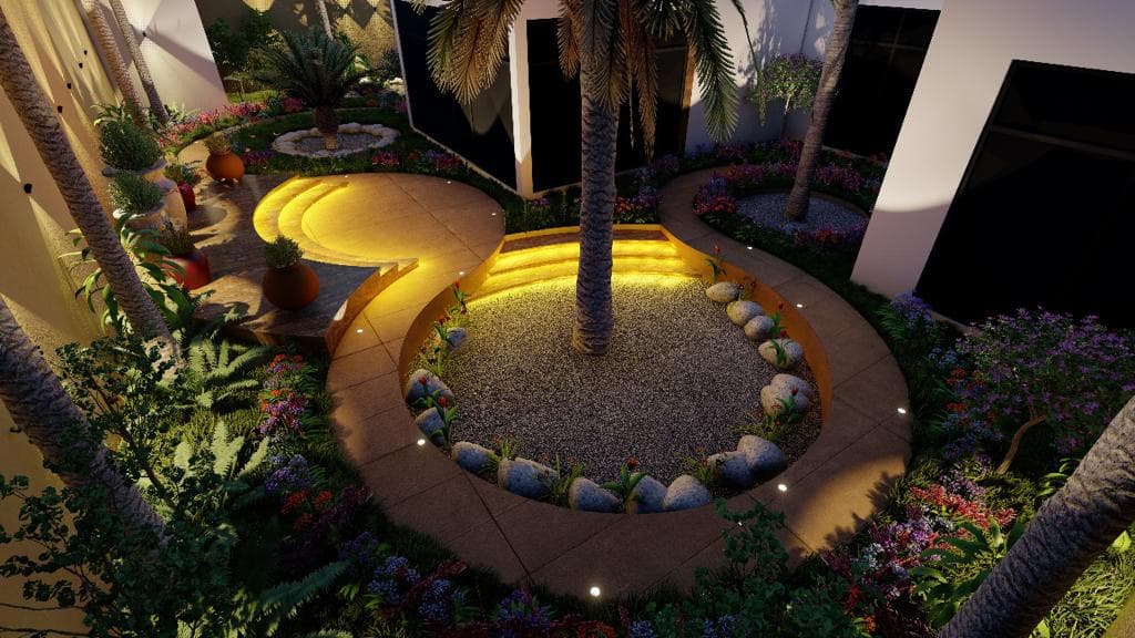 Circular sunken garden court at night: an uplit palm on a pebble bed, curved illuminated seating wall and dense flowering planting