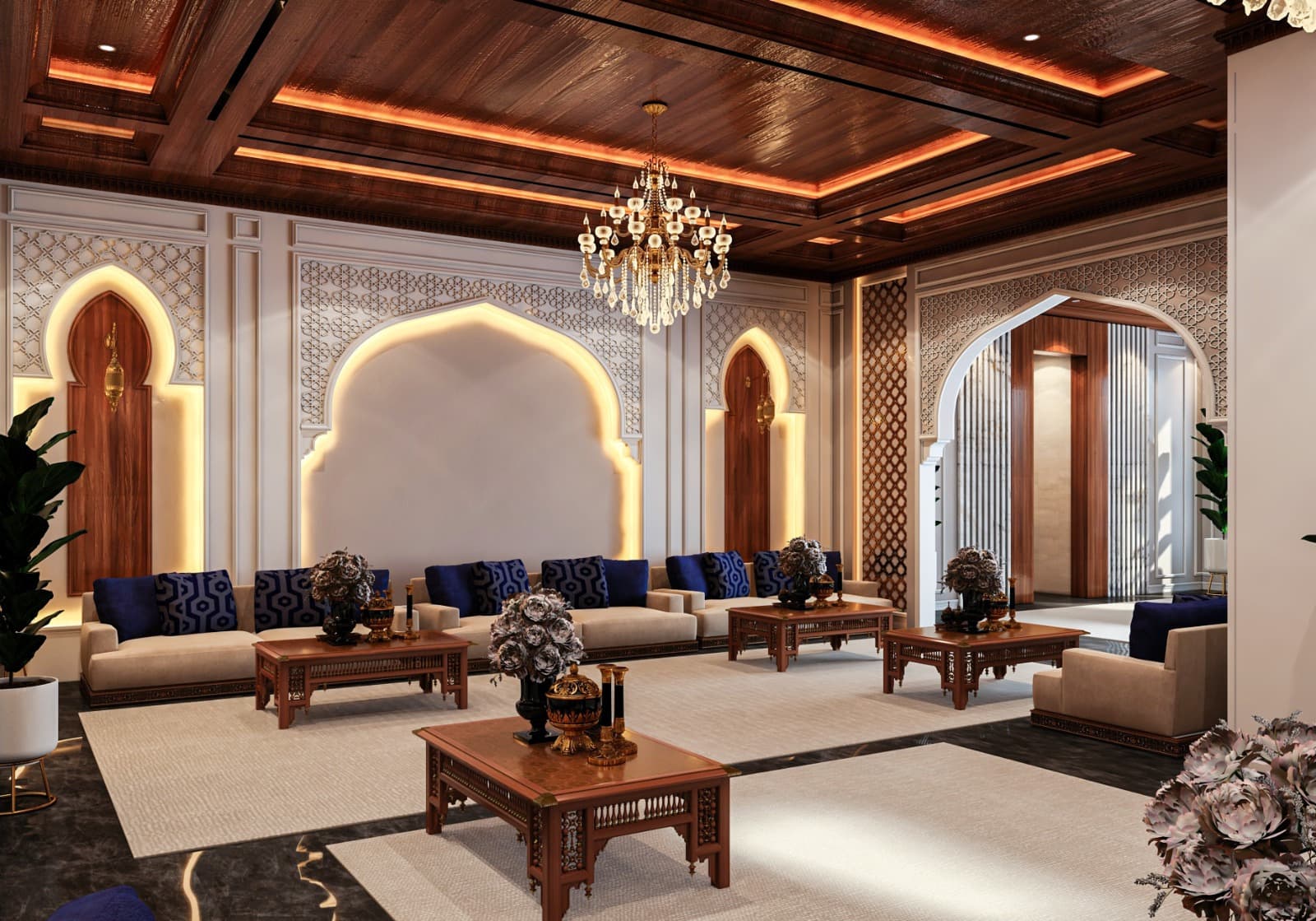 Grand Najdi majlis: gilded pointed arches, timber coffered ceiling, crystal chandeliers and navy-and-cream floor seating