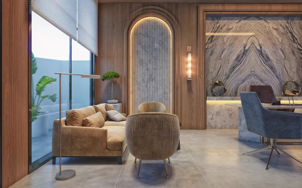 Lounge with a marble archway and bronze upholstered seating