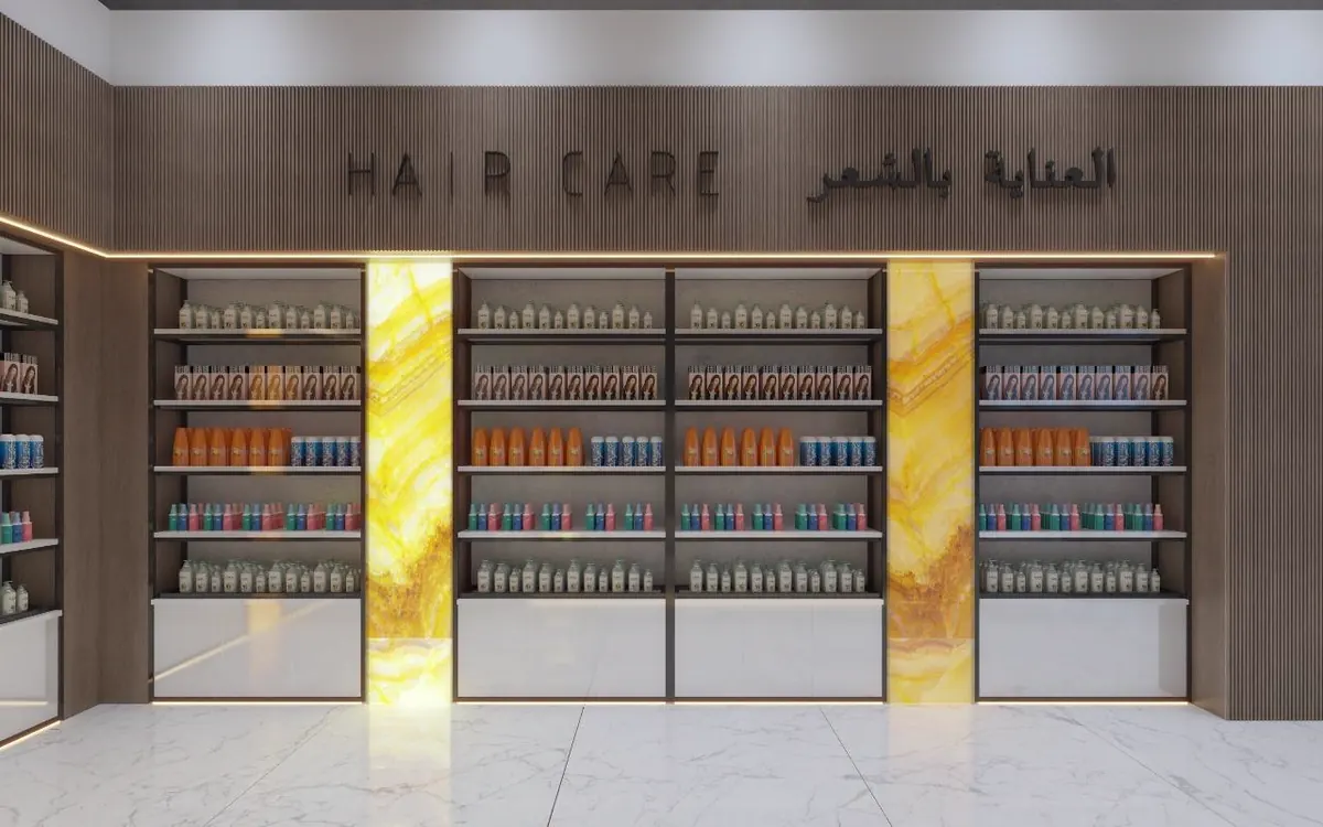 Hair-care retail floor with backlit onyx shelving bays
