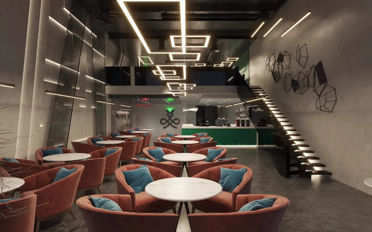 Lounge with terracotta and teal seating under a linear LED ceiling