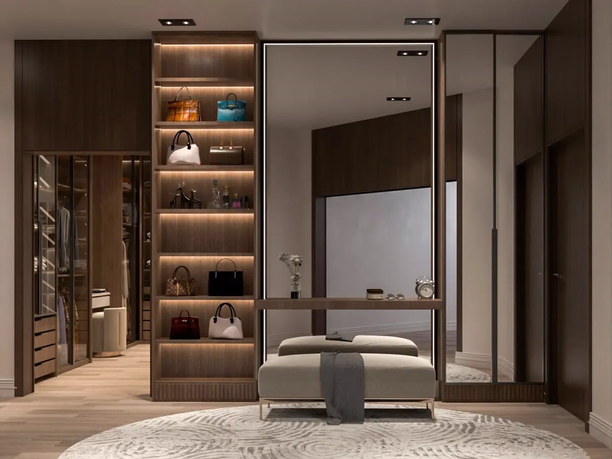 Dressing room with lit display shelving and a full-height mirror