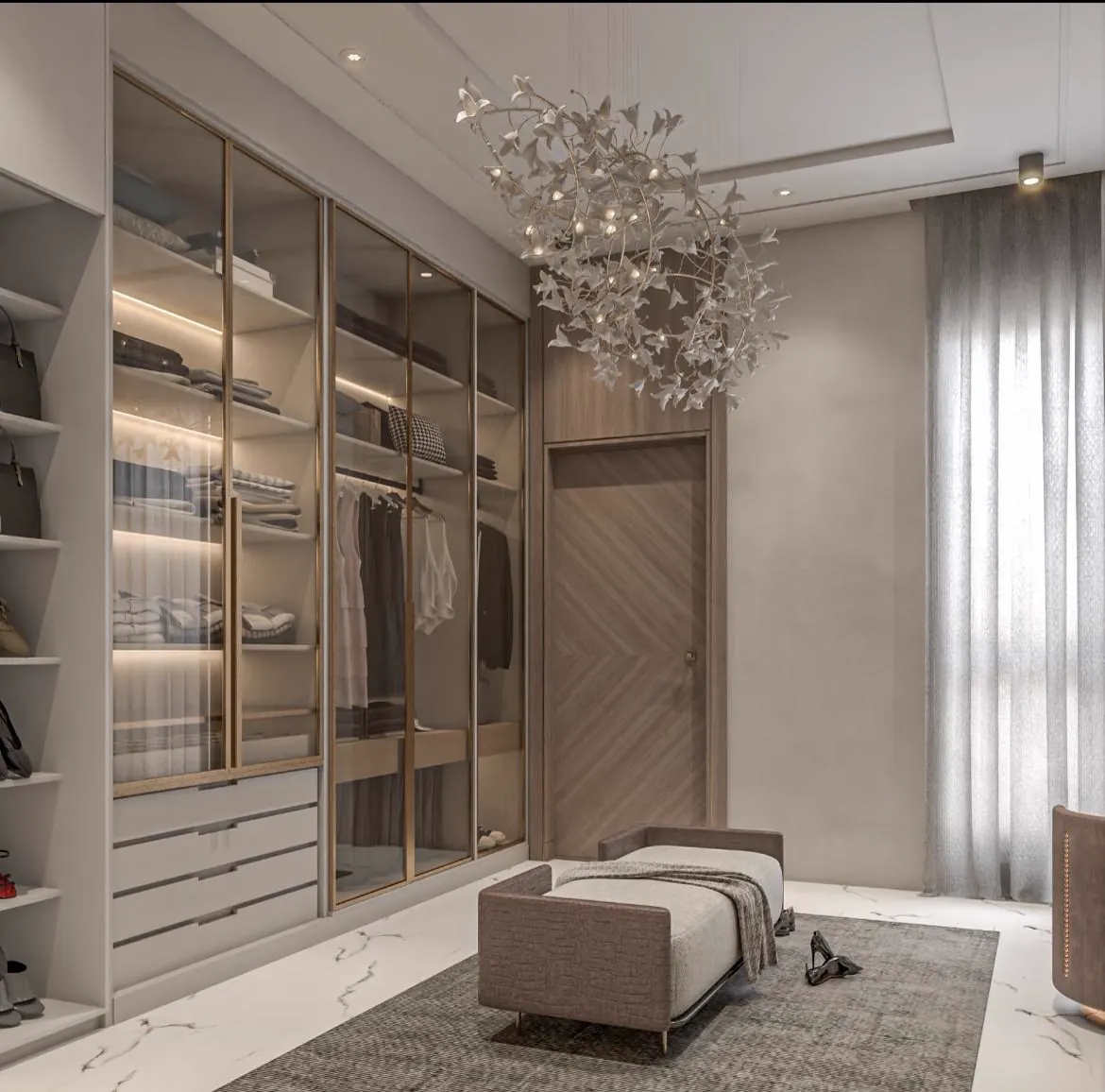 Walk-in wardrobe beneath a cascading chandelier