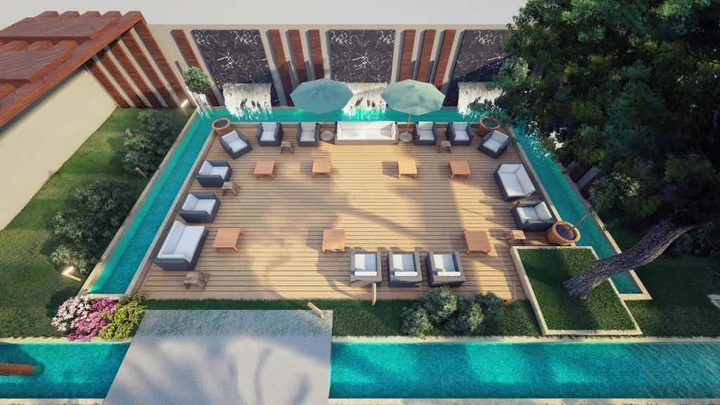 Aerial view of a pool terrace with loungers and pergola