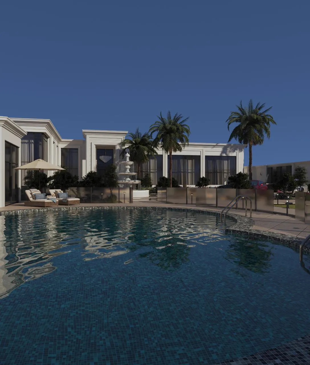 Swimming pool at dusk with the villa beyond