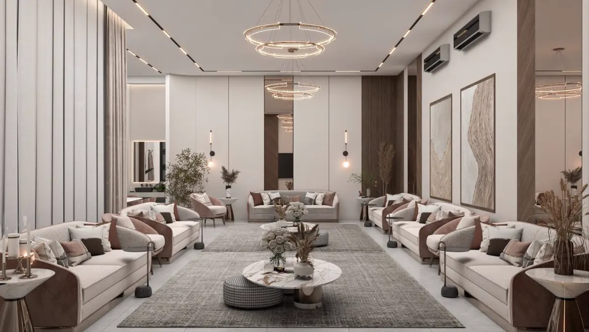 Long majlis in pale upholstery under a ring chandelier